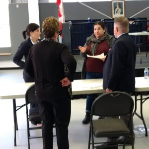 Lawyers Anne Sabourin (far left) and David Donnelly confer with Chief Phyllis Williams and Melissa Dokis of Curve Lake First Nation.